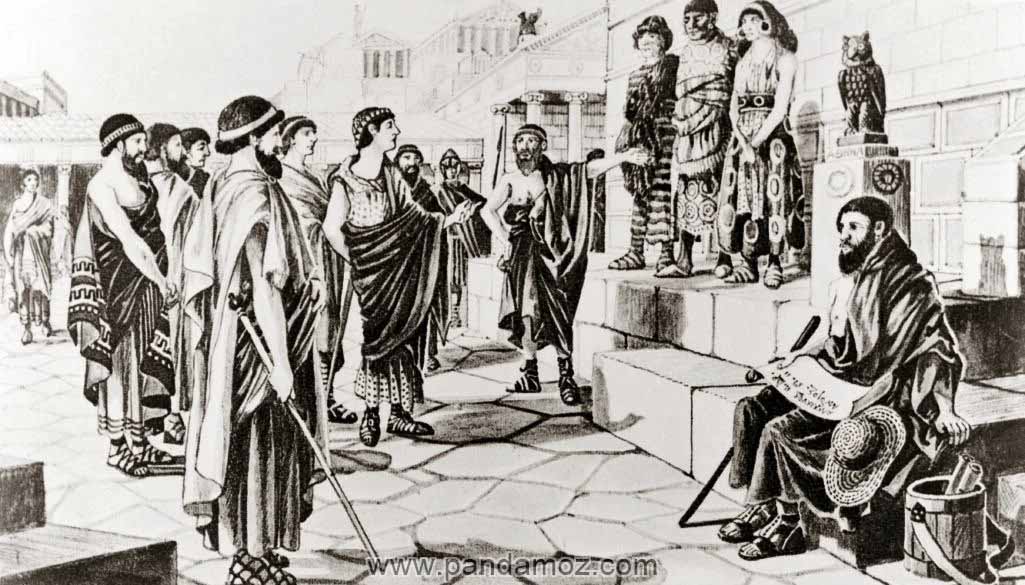 عکس سیاه و سفید از دوران باستان و کارگران و مردمی که جمع شده اند و سه نفر به صورت برده انسانی یا کارگر در بالای سکو ایستاده اند و فردی که گویا در حال فروش آنهاست. در تصویر مرد نابینایی در پایین سکو نشسته و لوحی بر دست دارد